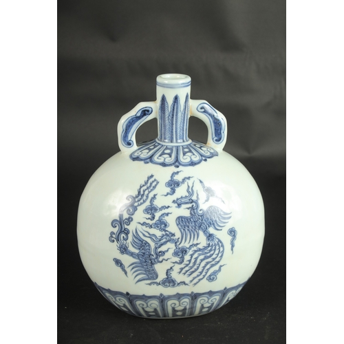 632 - A CHINESE BLUE AND WHITE PORCELAIN PHOENIX MOON FLASK. 28cms high.