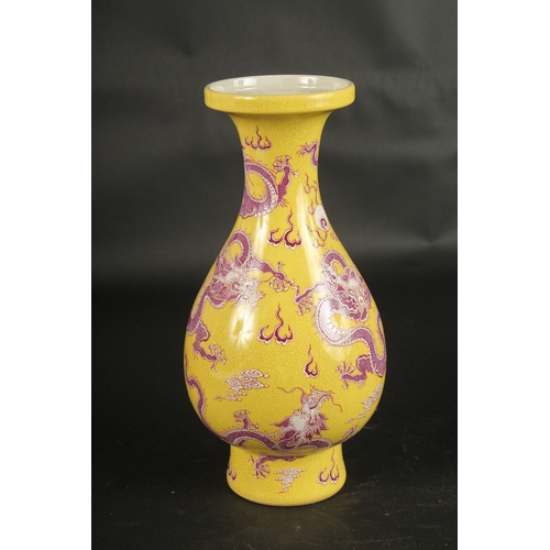 634 - A CHINESE YELLOW GROUND DRAGON VASE.