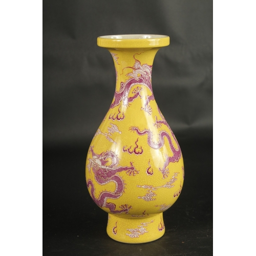 634 - A CHINESE YELLOW GROUND DRAGON VASE.