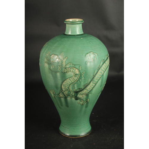 637 - A CHINESE JIAN WARE DRAGON VASE. 32cms high.