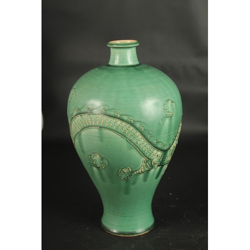 637 - A CHINESE JIAN WARE DRAGON VASE. 32cms high.