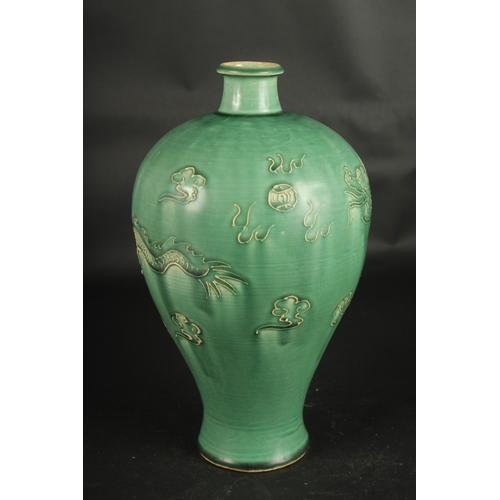 637 - A CHINESE JIAN WARE DRAGON VASE. 32cms high.