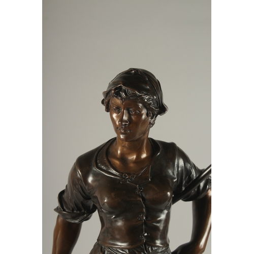 661 - EDOUARD DROUOT (1859-1945) FRENCH A SUPERB LARGE BRONZE OF A YOUNG LADY holding a hay fork. The two-... 