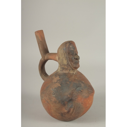 675 - A SOUTH AMERICAN POTTERY VESSEL, modelled as a man. 22cms high.