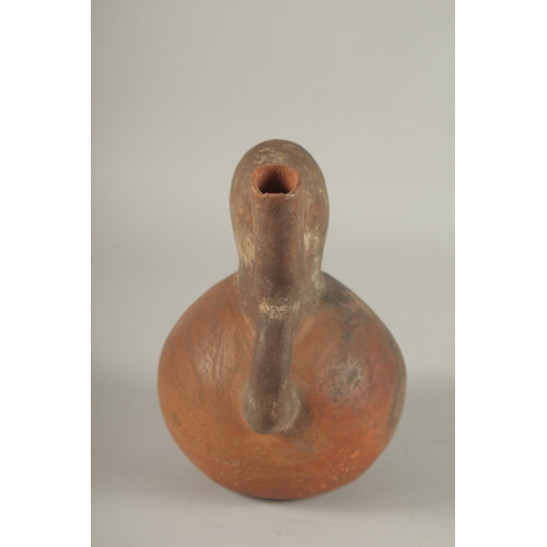 675 - A SOUTH AMERICAN POTTERY VESSEL, modelled as a man. 22cms high.