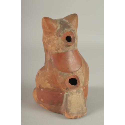 676 - A SOUTH AMERICAN POTTERY VESSEL, modelled as a seated figure (faults). 22cms high.