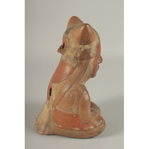 676 - A SOUTH AMERICAN POTTERY VESSEL, modelled as a seated figure (faults). 22cms high.