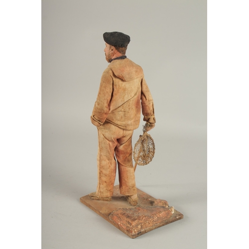 678 - AN UNUSUAL MAQUETTE OF A STANDING FRENCHMAN by J. LE BROEC, made from fibre, wood and painted. 32cms... 