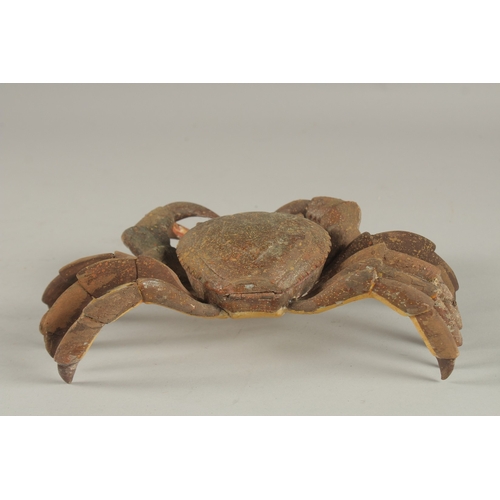 680 - AN UNUSUAL JEWELLERY BOX, in the form of a carved wood and painted crab. 27cms wide.