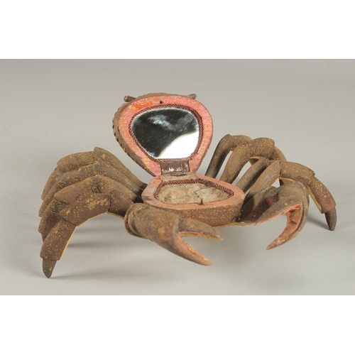 680 - AN UNUSUAL JEWELLERY BOX, in the form of a carved wood and painted crab. 27cms wide.