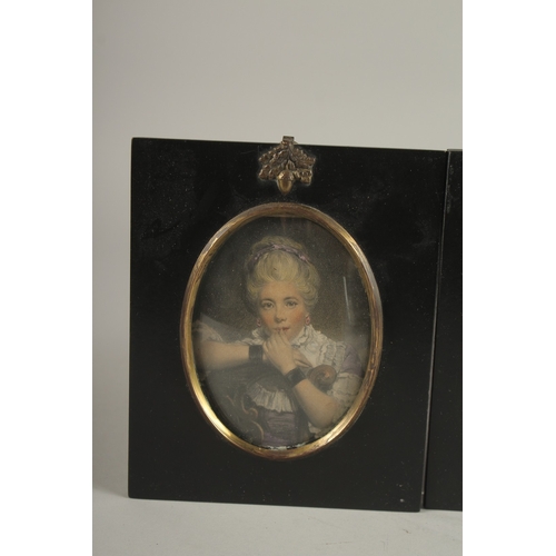 683 - A SET OF FOUR LATE VICTORIAN PORTRAIT MINIATURES OF LADIES. Each: 15cms x 12.5cms.