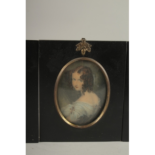 683 - A SET OF FOUR LATE VICTORIAN PORTRAIT MINIATURES OF LADIES. Each: 15cms x 12.5cms.