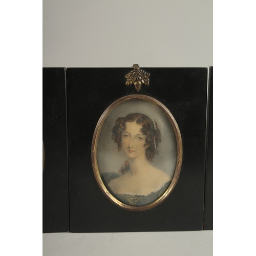 683 - A SET OF FOUR LATE VICTORIAN PORTRAIT MINIATURES OF LADIES. Each: 15cms x 12.5cms.