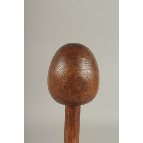 686 - A 19TH CENTURY WOODEN HAT OR WIG STAND. 34cms high.