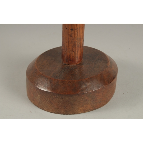 686 - A 19TH CENTURY WOODEN HAT OR WIG STAND. 34cms high.