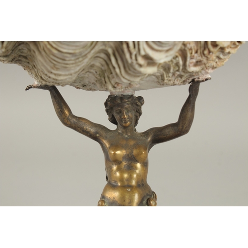 690 - A CAST BRONZE FIGURAL CENTREPIECE, modelled as a seated mermaid holding aloft a shell. 22cms high.... 