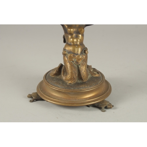 690 - A CAST BRONZE FIGURAL CENTREPIECE, modelled as a seated mermaid holding aloft a shell. 22cms high.... 