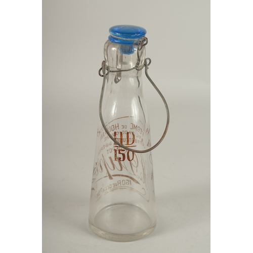 693 - A FRENCH ADVERTISING MILK BOTTLE. 25cms high.