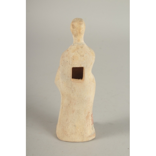 705 - A TERRACOTTA ANTIQUE OF A STANDING LADY. 7ins high.