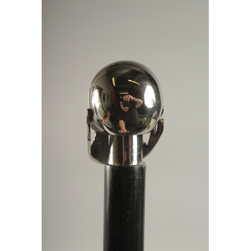 732 - A WOODEN WALKING STICK WITH SKULL HANDLE.