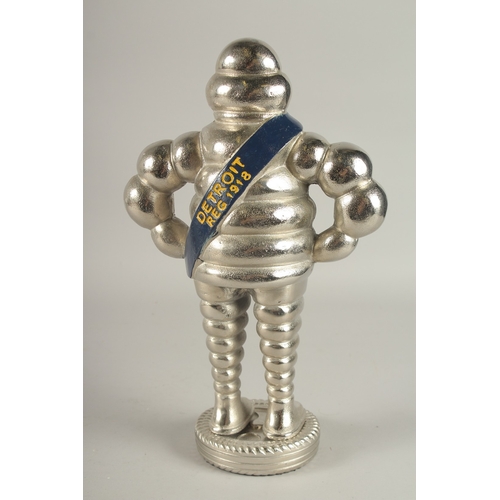 748 - A SILVER-PLATED MICHELIN MAN. 14.5ins high.