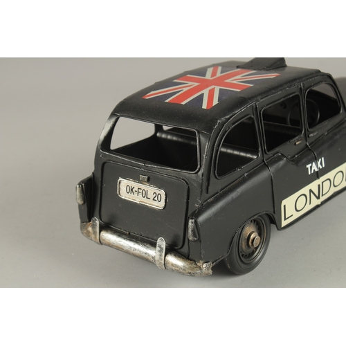 750 - A TIN PLATE LONDON TAXI.