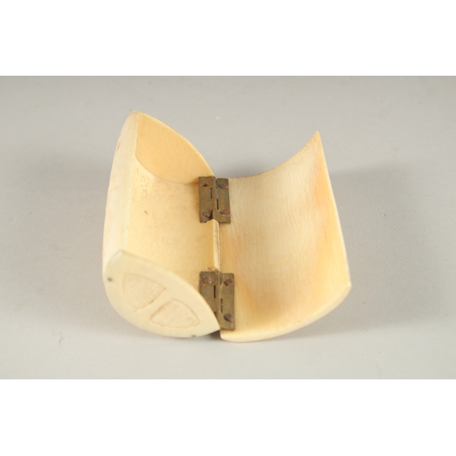 831 - A CARVED BONE SNUFF BOX. 9cms long.