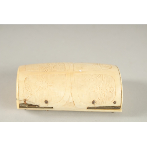 831 - A CARVED BONE SNUFF BOX. 9cms long.