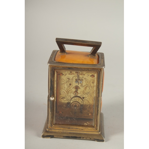 833 - A RARE VICTORIAN SILVER AND AMBER CLOCK, 4ins high, the silver case set with amber panels and precio... 