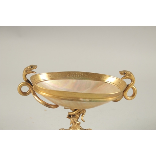 835 - A GRAND TOUR MOTHER-OF-PEARL and GILT METAL TWO HANDLED TAZZA, on a marble base with snake handles. ... 