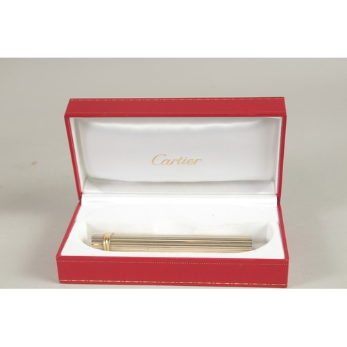 843 - A CARTIER LONG LIGHTER. 4.75ins long. No. 80873N, boxed.