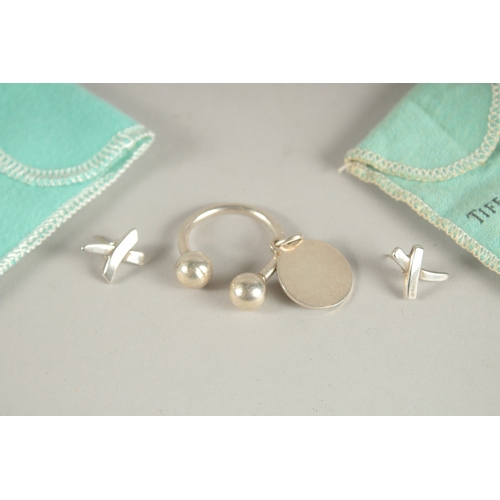 865 - TIFFANY, a pair of earrings and a keyring, boxed.