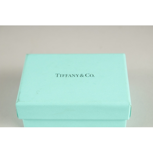 865 - TIFFANY, a pair of earrings and a keyring, boxed.