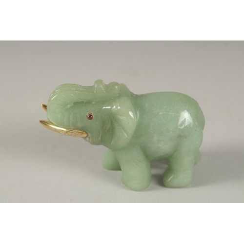 875 - A RUSSIAN CARVED JADE ELEPHANT with silver gilt tusks and stone eyes. Maker H. W. Faberge, in a fitt... 