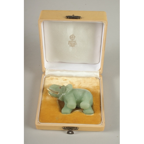 875 - A RUSSIAN CARVED JADE ELEPHANT with silver gilt tusks and stone eyes. Maker H. W. Faberge, in a fitt... 