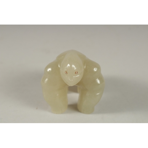 876 - A RUSSIAN CARVED JADE GORILLA with diamond eyes. 3ins, in a fitted box.