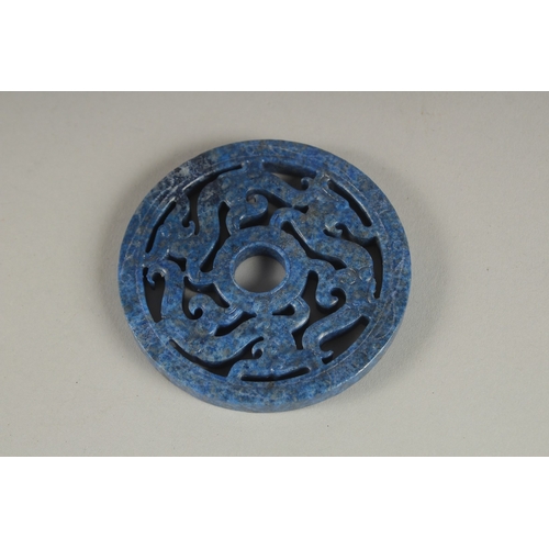 904 - A CHINESE PIERCED LAPIS ROUNDEL. 2.75ins.