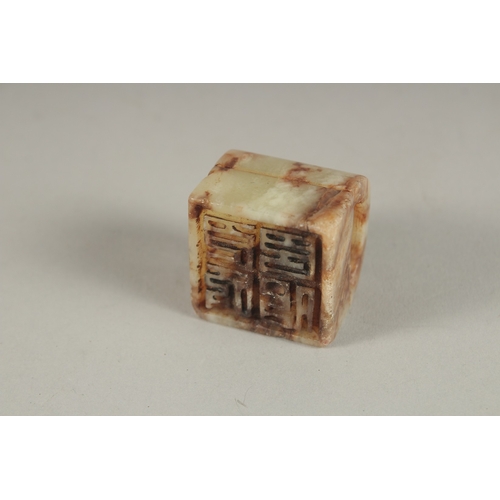 908 - A SMALL CHINESE CARVED JADE SEAL. 1cm square.