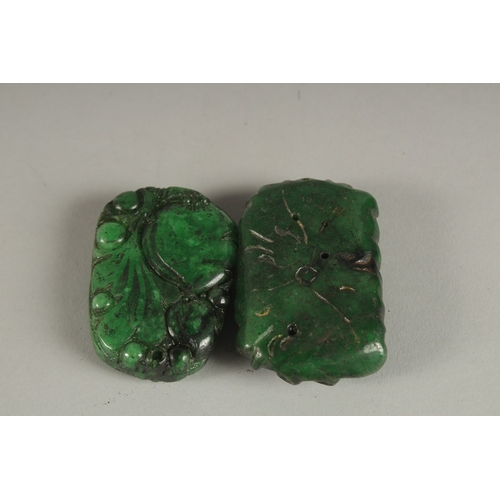 922 - TWO CARVED JADE PENDANTS.