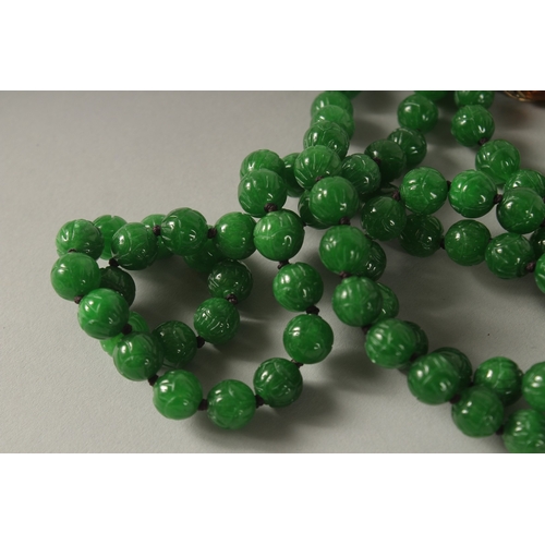 954 - A SUPERB JADE BEAD NECKLACE with diamond, gold and citrine clasp.