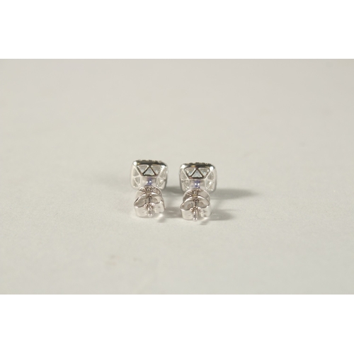 990 - A PAIR OF 18CT WHITE GOLD, BLUE TOPAZ AND DIAMOND CUSHION SHAPE EAR STUDS.