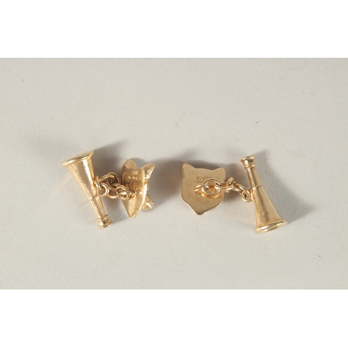 994 - A PAIR OF 9CT YELLOW GOLD FOX AND HORN CUFFLINKS.