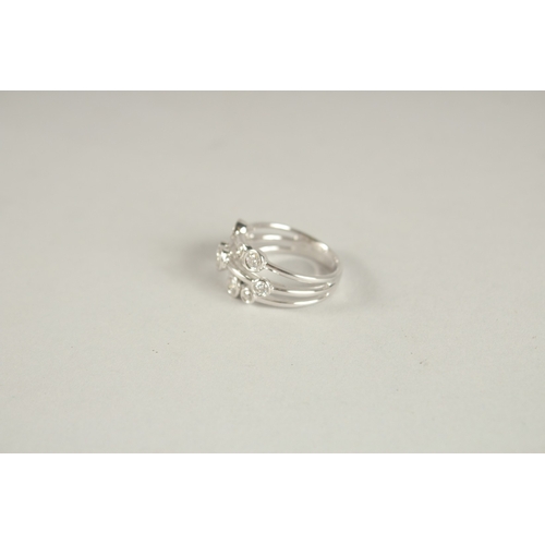 999 - AN 18CT WHITE GOLD AND DIAMOND BUBBLE RING.