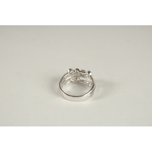 999 - AN 18CT WHITE GOLD AND DIAMOND BUBBLE RING.