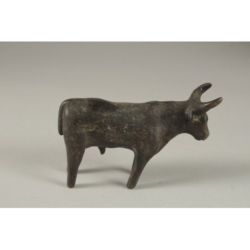 107 - A POSSIBLY ANCIENT LURISTAN OR INDUS VALLEY BRONZE BULL, 13.5cm long.