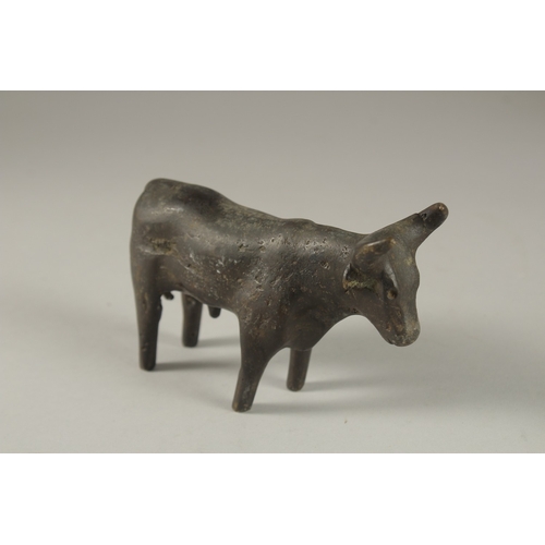 107 - A POSSIBLY ANCIENT LURISTAN OR INDUS VALLEY BRONZE BULL, 13.5cm long.