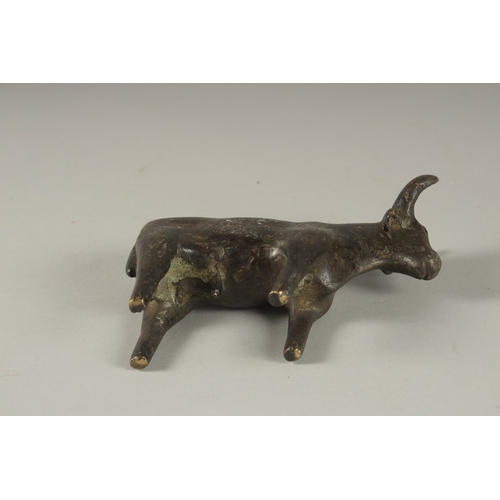 107 - A POSSIBLY ANCIENT LURISTAN OR INDUS VALLEY BRONZE BULL, 13.5cm long.