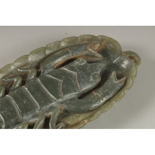 11 - A GREEN SOAPSTONE CARVING, of leaf form with large insect to centre, 26cm long.