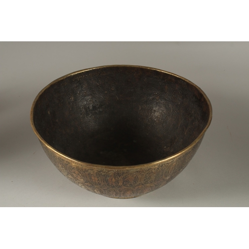 110 - A FINELY ENGRAVED 19TH CENTURY PERSIAN QAJAR BRASS BOWL, 25cm diameter.