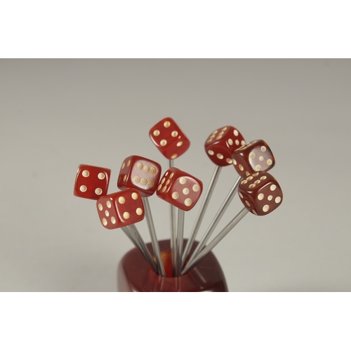 116 - A RARE EARLY 20TH CENTURY ART DECO BAKELITE CHERRY AMBER TYPE DICE SHAPED COCKTAIL FOLKS.